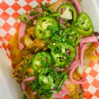 Aguachile Wings · Salt and pepper seasoned wings in a jalapeno aguachile sauce, topped with pickled onions, ja...