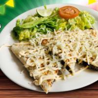 Quesadilla · Flour tortilla stuffed with your choice of meat, cheese topped with sour cream and cheese se...