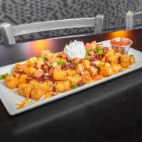 Totchos · Golden fried tater tots loaded with bacon bits, cheese, tomatoes, green onions, sour cream a...