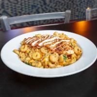 Tuscan Macaroni and Cheese  · Grilled chicken breast, baby spinach, sun-dried tomatoes and onions in a rich, creamy Parmes...