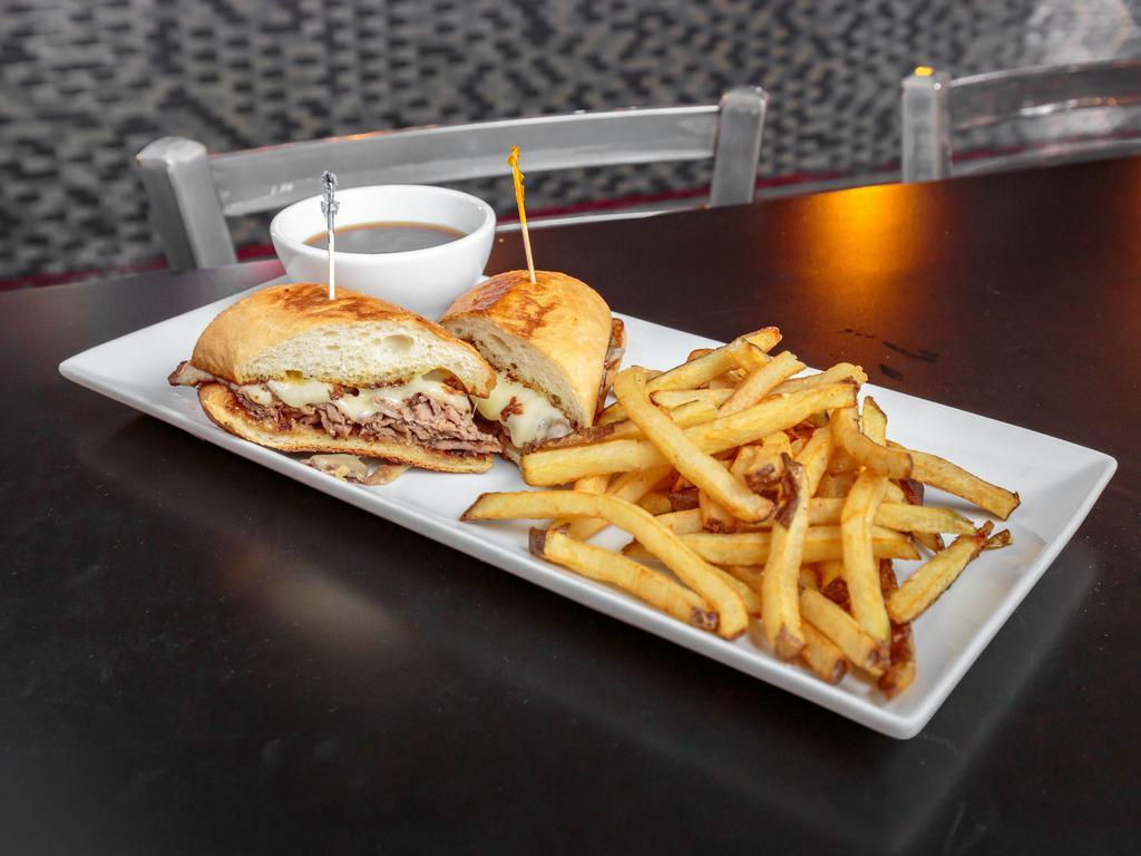 French Dip Sandwich  · Roasted sirloin piled on French roll with melted Swiss cheese and au jus.