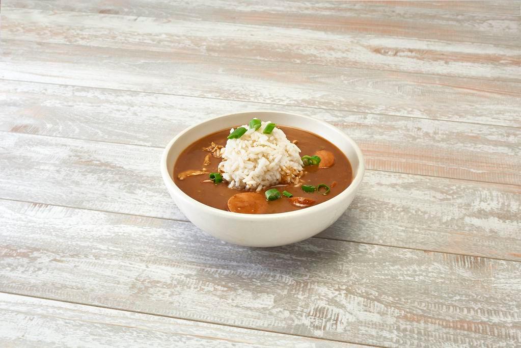 Smoked Sausage Gumbo Bowl · We start with a deep brown roux, onions, celery and is served with smoked sausage. Served over steamed rice and Texas toast. Spicy.