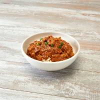 Voodoo Chicken Bowl · Slow-cooked chicken in spic Cajun tomato sauce with garlic and our blend of voodoo spices. S...