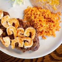 Los 3 Garcia's Special · Mmm! Delicious rib eye steak cooked to perfection, topped with grilled shrimp. Served with r...