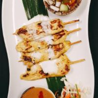 Chicken Satay · South East Aslan favorite! Grilled marinated chicken breast In a skewer served with peanut s...