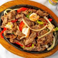 Fajita 3 Meat Mix · Fajitas with mix of chicken, steak, shrimp, bell peppers and onions. Side of rice, beans, le...