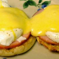 Eggs Benedict Original Style · English muffins topped with Canadian bacon and poached eggs topped with hollandaise sauce.