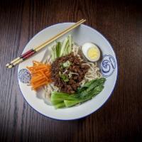 Beijing Bowl · An iconic Northern Chinese dish consisting of egg noodles topped with a pork and soy bean ba...