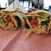 #3. Chicken Caesar Wrap · Grilled chicken breast with romaine lettuce, feta cheese, roasted red peppers and creamy Cae...