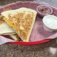 Quesadilla · Stuffed with choice of meat, sauteed onions, peppers and cheese with salsa and sour cream.