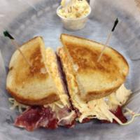 62. Hot Corn Beef Joe Sandwich · Thinly sliced corn beef topped with melted Swiss, coleslaw and Russian dressing on toasted r...