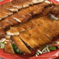 Crispy Chicken Salad · Breaded strips of chicken, romaine, Jack cheese, cherry tomatoes and shaved carrots. Served ...