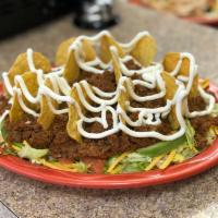 Taco Salad · Shredded lettuce, cheddar cheese, salsa, avocado, sour cream and your choice of meat with to...
