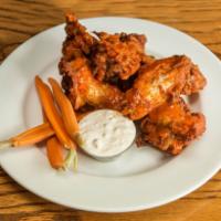 Chicken Wings · Crispy jumbo wings, with house-made bleu cheese dipping sauce and crudité. 6 Per Order. Opti...