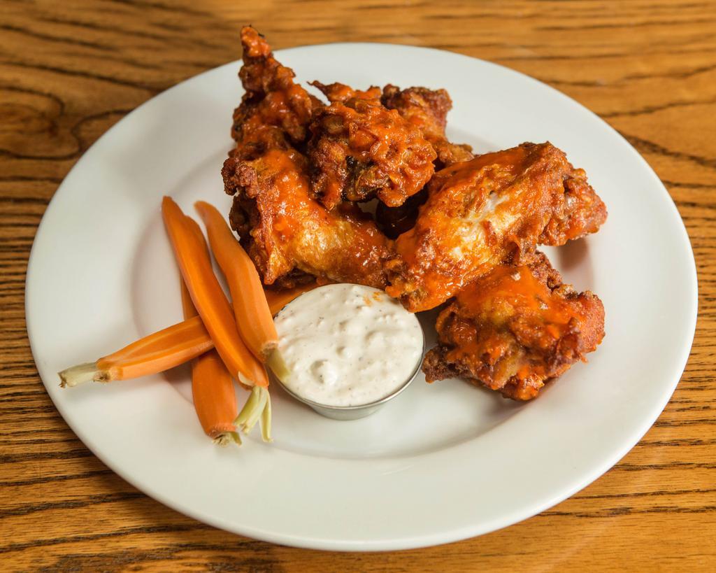Chicken Wings · Crispy jumbo wings, with house-made bleu cheese dipping sauce and crudité. 6 Per Order. Option of buffalo, soy ginger, or naked wings.