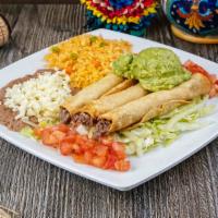 Taquitos Plate · Shredded beef taquitos (3). Served with beans, rice, guacamole, lettuce and tomato.