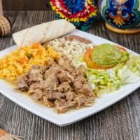 Chile Verde Plate · Chile verde meat (pork), beans, rice, guacamole, lettuce and tomato. Served with either corn...