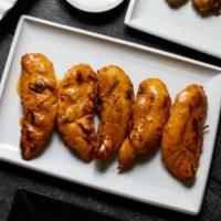 5 Peri-Peri Strips · Marinated chicken tender loins  in Portuguese Peri Peri sauce then flame grilled to order in...