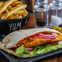 Chicken Pita · Marinated chicken breast in Portuguese Peri Peri sauce then flame grilled to order in your c...