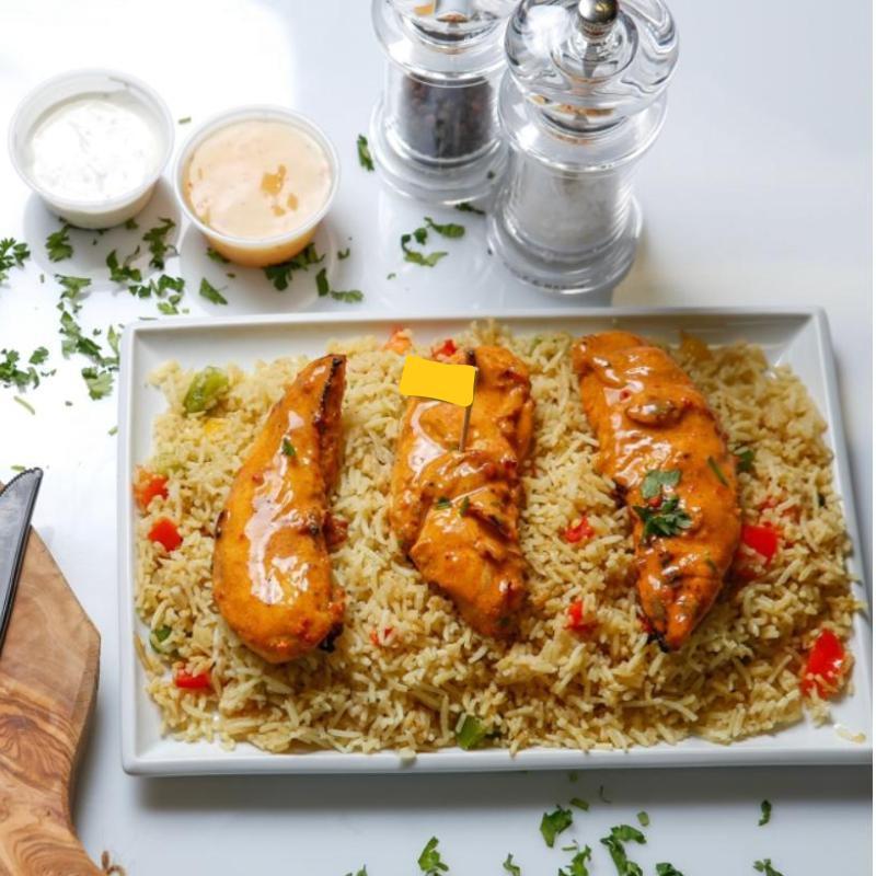 Chicken Strips Rice · Marinated chicken tender loins in Portuguese Peri Peri sauce then flame grilled to order in your chosen spice and served over freshly made seasoned rice.