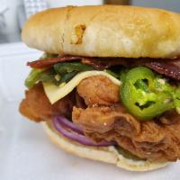 BB. Bacon Chicken Sandwich · Served with caramelized onion, pickle, lettuce, house mayo, and hand cut potato chips.