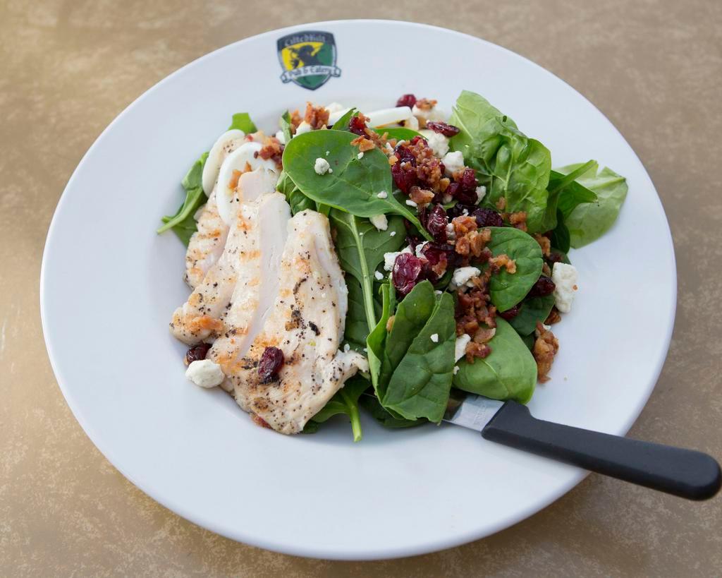 Spinach Chicken Salad · Fresh spinach, grilled chicken, applewood bacon bits, hard-boiled egg, dried cranberries, bleu cheese crumbles, citrus mustard vinaigrette.