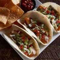 Fish Tacos · 3 tacos. Choose blackened or fried cod. Shredded cabbage, cilantro onions, cheddar jack chee...