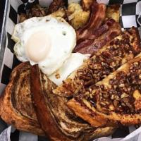 Napoleon Platter · 2 eggs your way with 2 brown sugar pecan french toast and choice of breakfast meat.