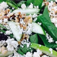 Seasonal Salad · Chopped greens with cucumber, nuts, fresh fruit & crumbled cheese with house vinaigrette.