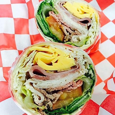 Barnyard Wrap · Our house-roasted, smoked & pit turkey, beef & ham, topped with honey mustard, fresh lettuce, tomato, & cheese in a grilled flour tortilla.