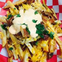 Loaded Farm Fries · Hand-cut boardwalk-style fries topped with chopped bacon, cheddar cheese & our house pimento...