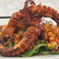 Grilled Octopus Lunch · Seasoned grilled octopus with crispy garbanzos, over scalloped potatoes and a bed of arugula 