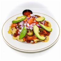 Nachos Dorados · Tortilla chips with chili con carne, jack & cheddar cheese, red onions,
tomatoes, jalapeños,...