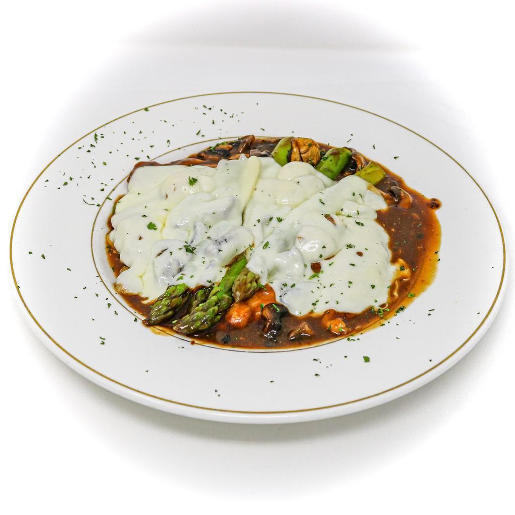 Chicken Madeira · Chicken breast sautéed with mushrooms, asparagus in a madeira
wine sauce & melted mozzarella cheese. Served with mashed potatoes.