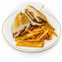 Avocado Club Sandwich · Grilled chicken breast, bacon, tomatoes, avocado, swiss cheese & mayonnaise. Served on a clu...