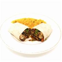 Chicken Teriyaki Wrap · Grilled chicken breast sautéed with garden mixed vegetables in a garlic teriyaki sauce. Serv...