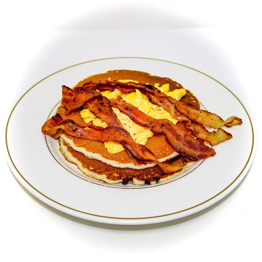 Trio Combo · Two pancakes with two eggs any style and your choice of ham, bacon or sausage