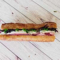 French Ham and Brie Ficelle · French ham and Marin farms brie on a buttered ficelle baguette with organic baby greens.