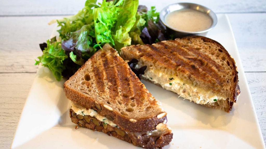 Tuna Melt Sandwich · White albacore tuna with fiscalini white cheddar, grilled and served with a side of mixed baby greens and champagne vinaigrette.
