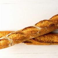 French Baguette, 1 · A long, thin loaf of French bread with a crisp crust and tender, airy crumb.