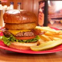Bacon Cheddar Steak Burger · Our steak burger topped with bacon, melted cheddar cheese, fried onion ring, tomato and lett...