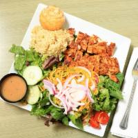 Grilled Chicken Special Plate · Served with rice pilaf, garden salad, and a warm orange roll.