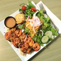 Wood-Fired Shrimp Kabob Plate · Served with rice pilaf, garden salad, and a warm orange roll.