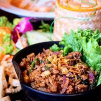 Larb Moo Kua · Northern Thai style ground pork, liver, pork intestine with spicy herb, onions, mint, cilant...