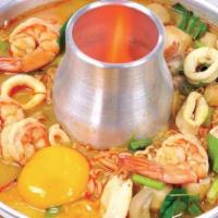 Tom Yum Soup · Hot sour soup with choice of chicken, tofu or prawns, fresh mushroom, tomatoes, onions, lemo...