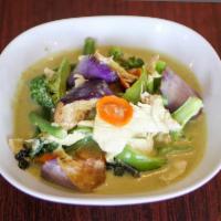 Green Curry · Green curry with coconut milk, green bean, eggplant, broccoli, bell pepper and sweet basil.