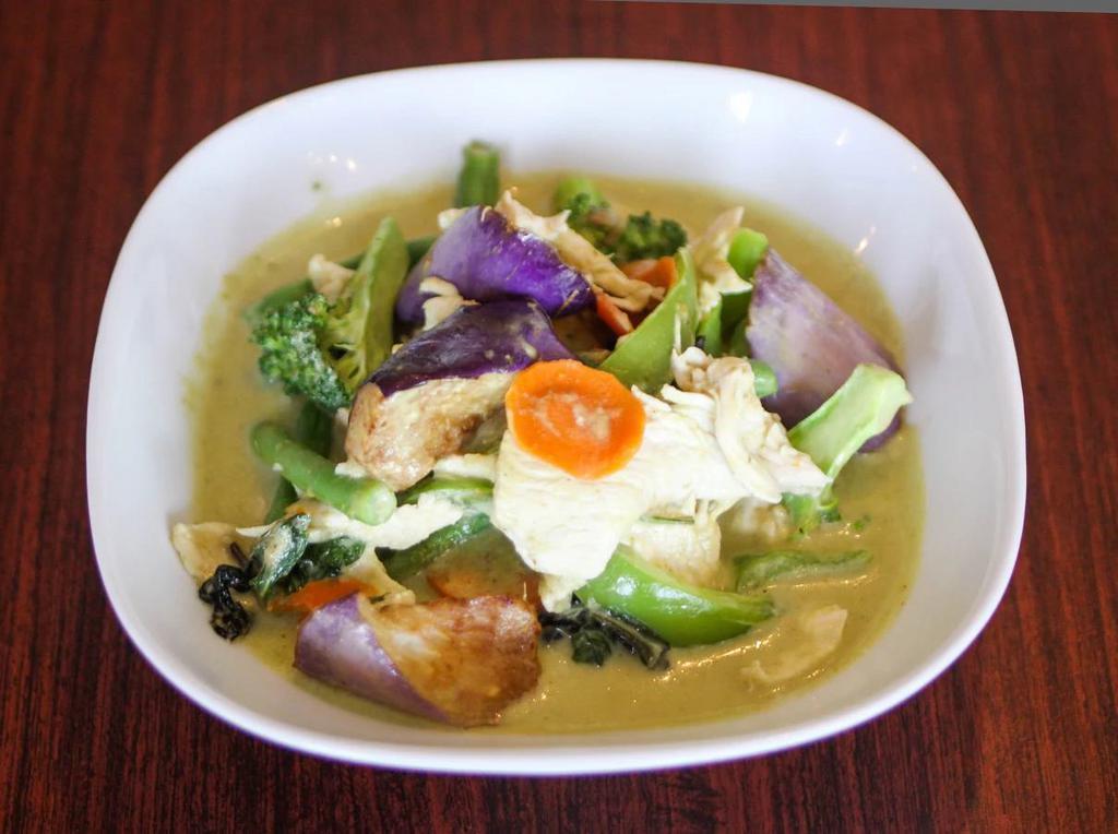 Green Curry · Green curry with coconut milk, green bean, eggplant, broccoli, bell pepper and sweet basil.