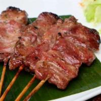 BBQ Pork · Grilled pork marinated in Thai herbs served with sweet and sour sauce.
