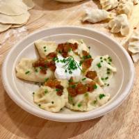 6 pieces Potato and Cheese (Ruskie) Pierogi · Potato and farmer cheese pierogi served with sour cream, caramelized onions and chives. Vege...