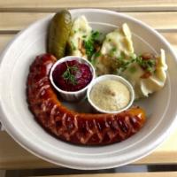 Kielbasa and Pierogi Platter · Grilled Polish sausage and 3 potato and cheese pierogi with a pickle, Kosciuszko mustard,  h...